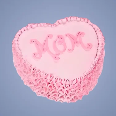 Heart-shaped pink Mother’s Day cake with “MOM” written in decorative icing