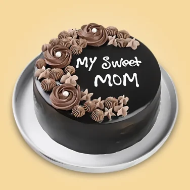 Chocolate Mother’s Day cake with “My Sweet Mom” message and decorative cream flowers